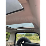 Rear cargo LED light installed in Land Rover Discovery 3 or 4 with aluminum clips and multiple lighting modes (red, yellow, white)