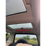 Rear cargo LED light installed in Land Rover Discovery 3 or 4 with aluminum clips and multiple lighting modes (red, yellow, white)