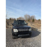 4-light roof pod kit mounted on Land Rover Discovery 3 or 4 with gloss black finish and adhesive no-drill install