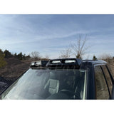 4-light roof pod kit mounted on Land Rover Discovery 3 or 4 with gloss black finish and adhesive no-drill install
