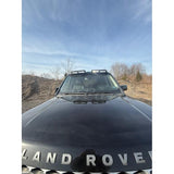 4-light roof pod kit mounted on Land Rover Discovery 3 or 4 with gloss black finish and adhesive no-drill install