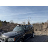 4-light roof pod kit mounted on Land Rover Discovery 3 or 4 with gloss black finish and adhesive no-drill install