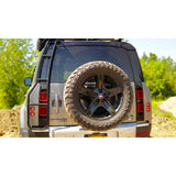 Offset tire carrier for oversized tires