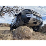 Proud Rhino Rock Sliders for Defender 110 – Frame-mounted 3/16 inch steel with EAS compressor protection and optional professional crating