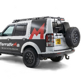 Terrafirma swing away spare tire carrier for LR3 and LR4 with black powder-coated finish, gas strut assist, and stainless steel latch