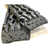 TRED Pro off-road recovery boards with black traction lugs, dual composite construction, and rugged design for sand, mud, and snow