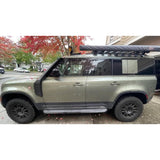 Proud Rhino Rock Sliders for Defender 110 – Frame-mounted 3/16 inch steel with EAS compressor protection and optional professional crating