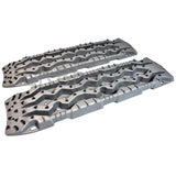 TRED Pro off-road recovery boards with black traction lugs, dual composite construction, and rugged design for sand, mud, and snow