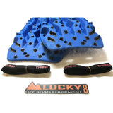 TRED Pro off-road recovery boards with black traction lugs, dual composite construction, and rugged design for sand, mud, and snow
