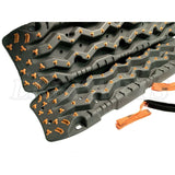 TRED Pro off-road recovery boards with black traction lugs, dual composite construction, and rugged design for sand, mud, and snow