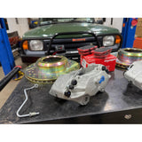 Defender front brake upgrade kit for Discovery 1 LJ LG. Vented rotors, calipers, pads, with optional hard brake tubes.