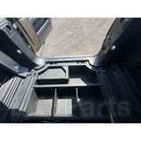 Molded plastic underfloor storage kit for Defender 110 L663, replaces factory foam, jack storage included.