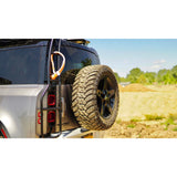 Offset tire carrier for oversized tires